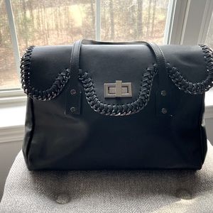 Black handle bag with metal hardware